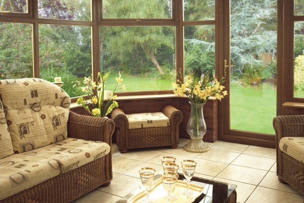 Furniture on the veranda overlooking the green courtyard