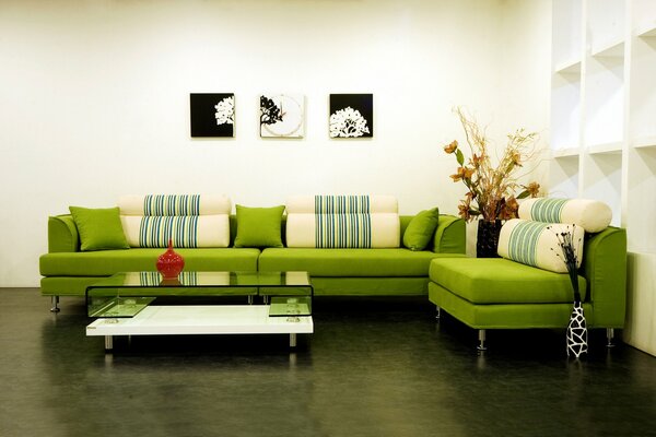 Fashionable green sofa with ottomans and pillows