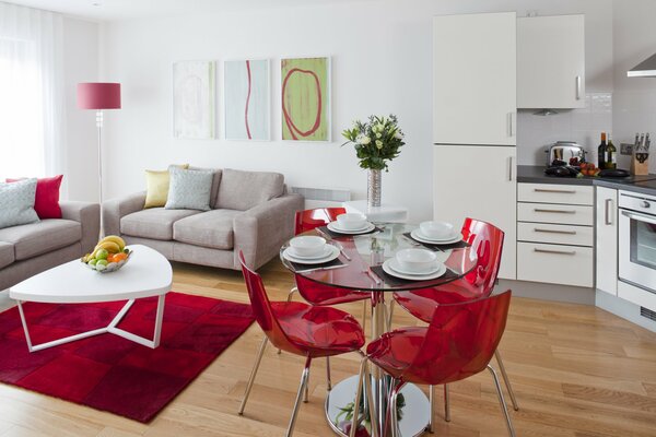 The interior of the living room in red and white tones