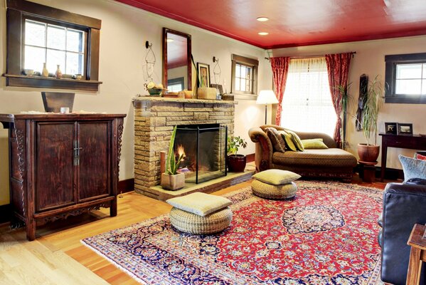 Living room with fireplace and red carpet