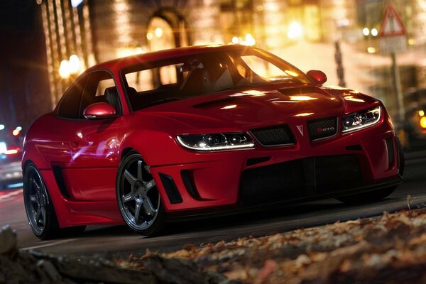 Red chic pontiac in golden lights