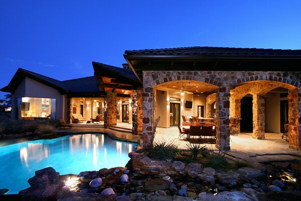 Exterior of the house with a terrace and stone columns