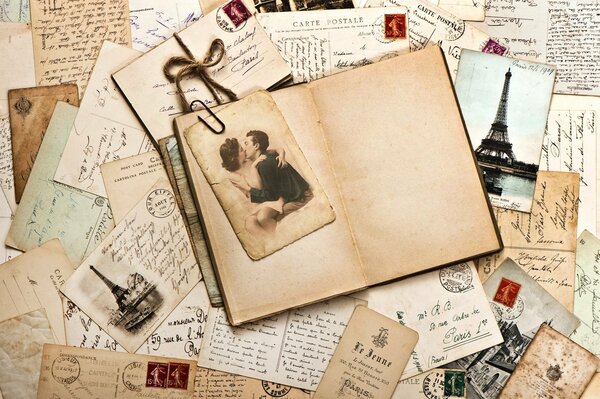 Vintage postcard on scattered letters