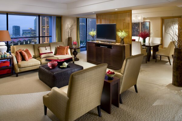 Living room with beige sofa and armchairs