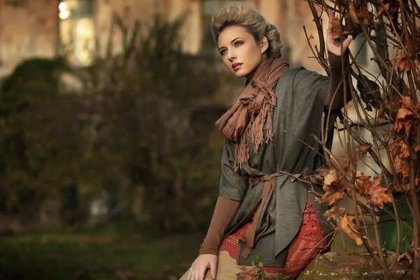 Autumn portrait. Girl and branches