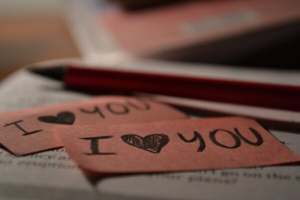 I love you with a pencil on a book