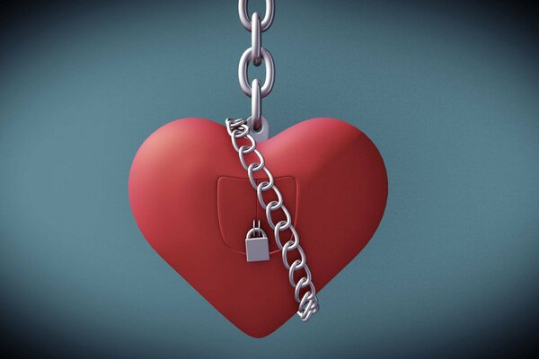 Red heart on a chain with a lock