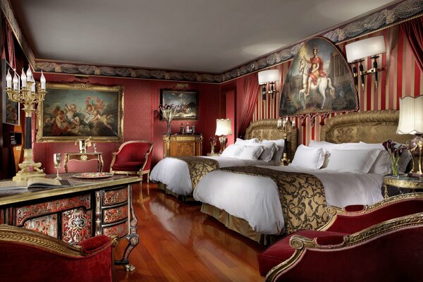 Diagonal bedroom with expensive paintings