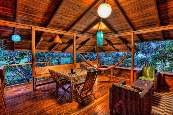 Wooden veranda with wicker furniture