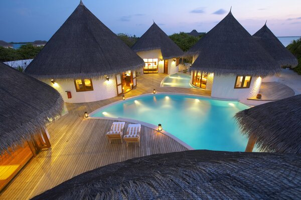 Cozy houses by the pool with sun beds