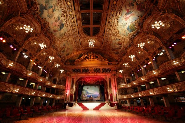 Beautiful ballroom with boxes and chandeliers