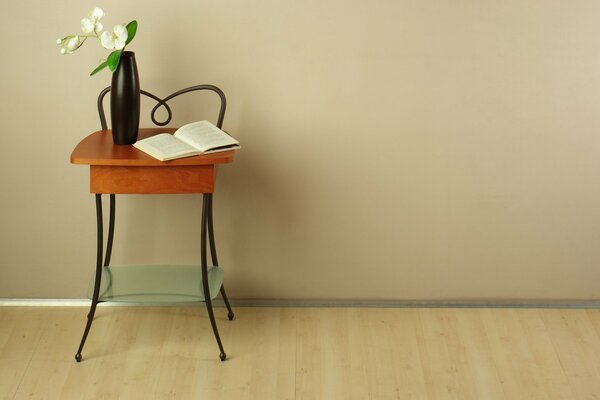 Coffee table with vase and book