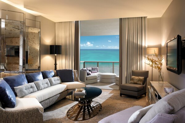 Beige interior of the living room with ocean view