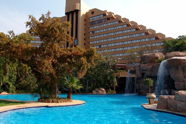 African hotel with a swimming pool with unusual architecture