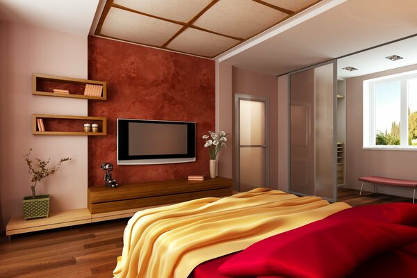 Yellow bedspread in the bedroom with a TV