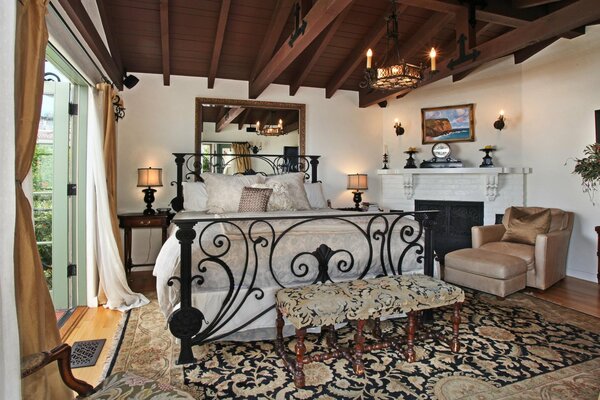 Bedroom interior with a bed and candles