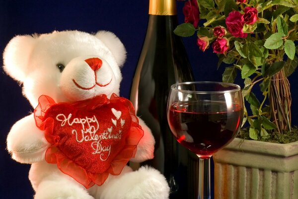 Romantic setting. Teddy bear and a glass of wine