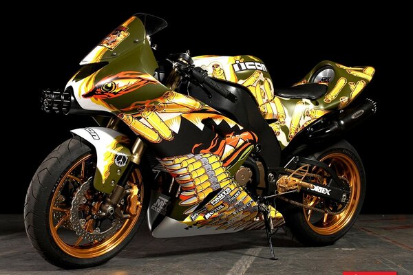 A large tuned motorcycle with a bright print on a black background