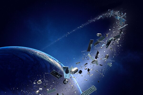 Space metal debris on the background of the planet