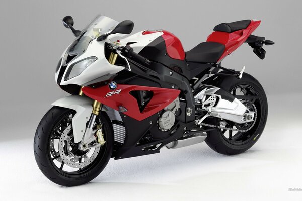 On a neutral background - a bright sports motorcycle