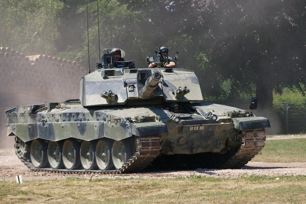 British main battle tank on the road along the forest