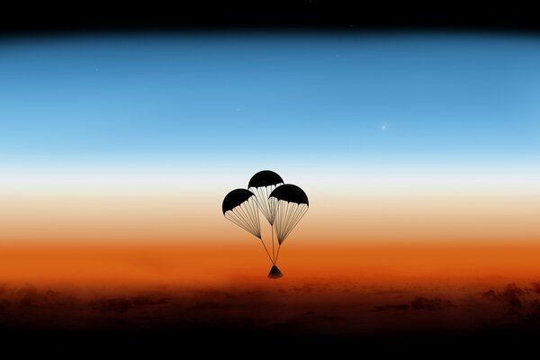 Trois parachutes ont décollé dans le ciel au coucher du soleil