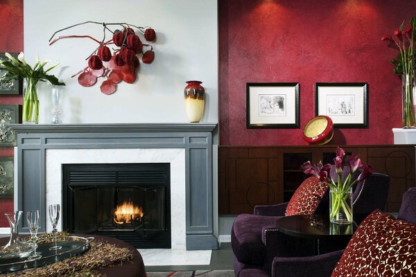 Room with fireplace with red wallpaper