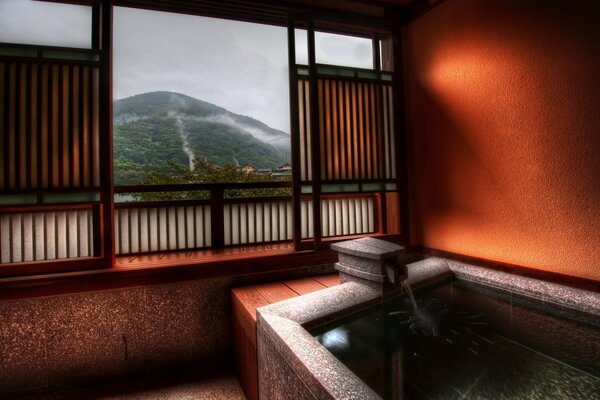 Ванна в Японии с видом из окна на горы