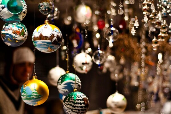 Christmas balls with different images among glass beads