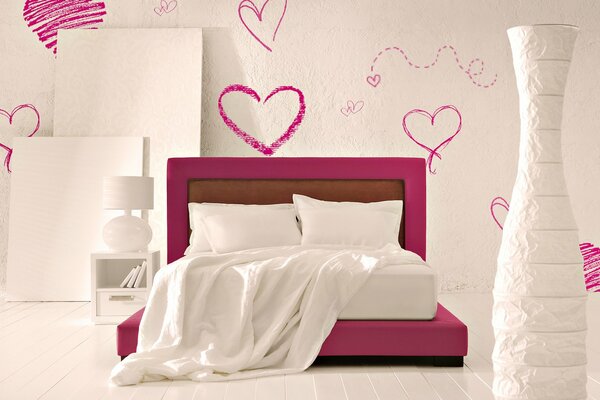 Red bed on the background of hearts