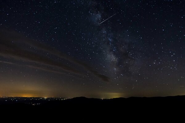 Distant lights of the city, the sky in the stars, the Milky Way