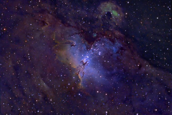 The blue glow of a nebula in stellar space