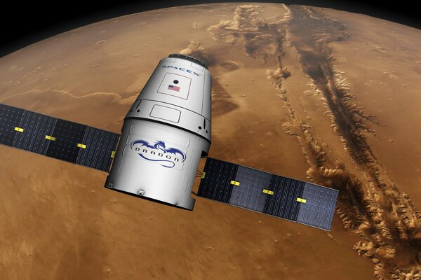 Spacex s private Dragon transport spacecraft over the surface of Mars