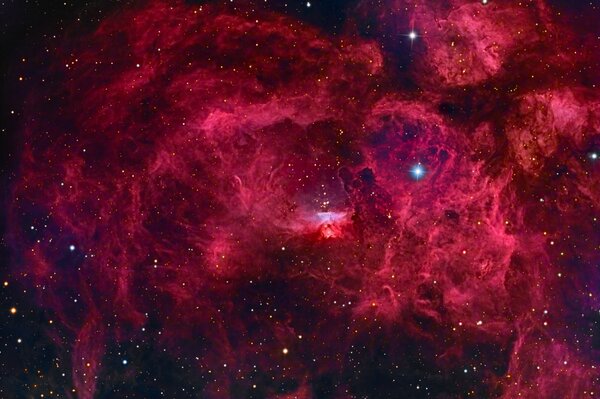 A nebula in space is a red constellation