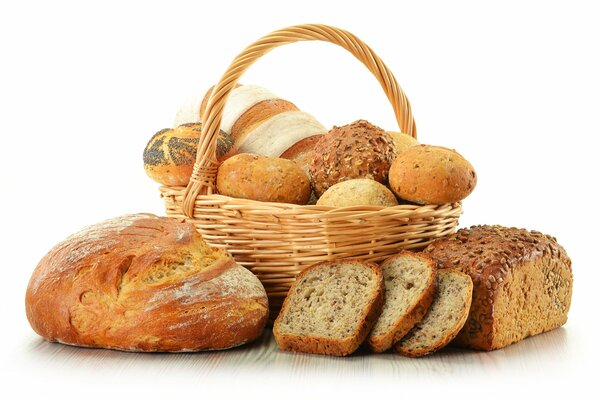 A large bread basket with various breads and buns