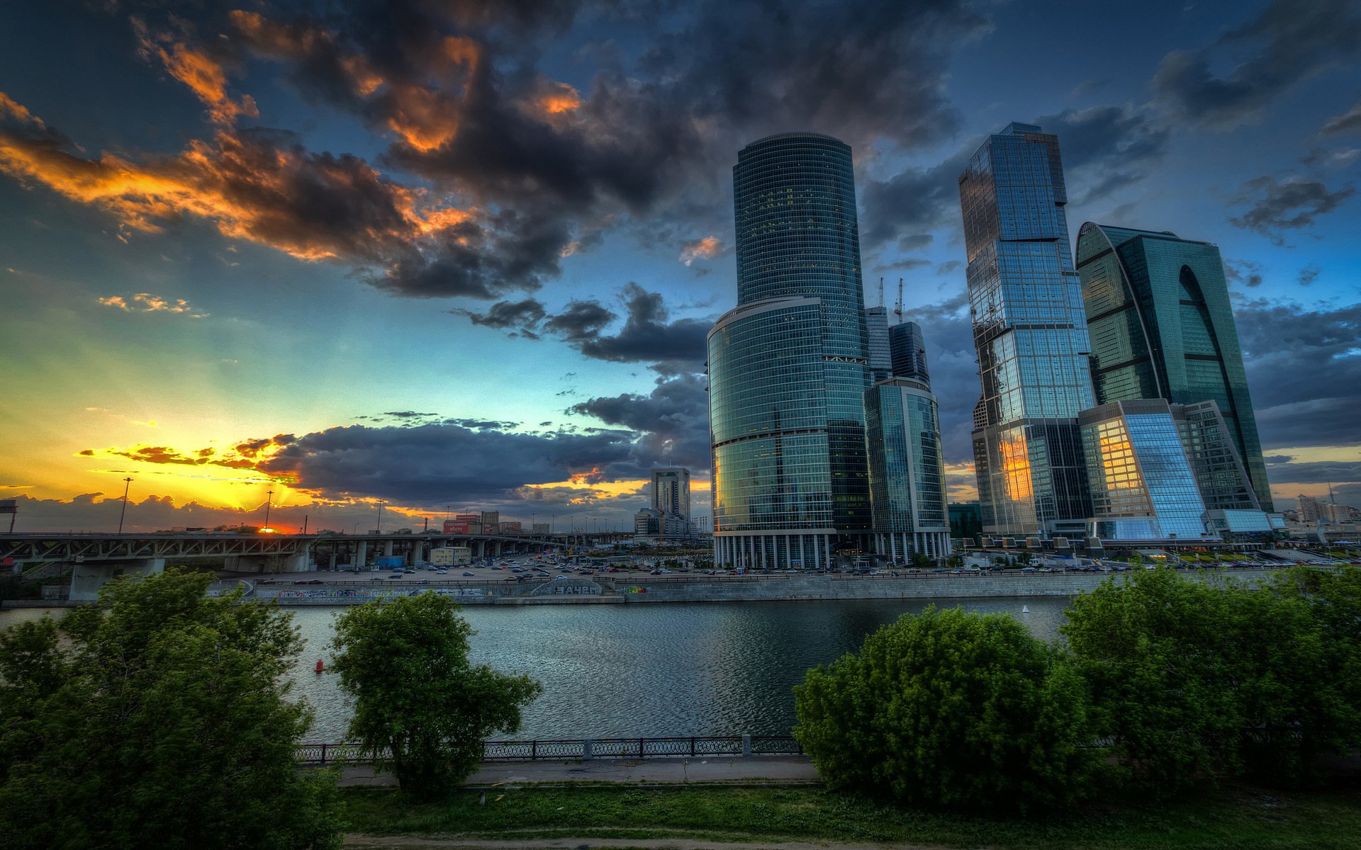 moscow capital moscow city clouds sunset river bridge trees embankment car