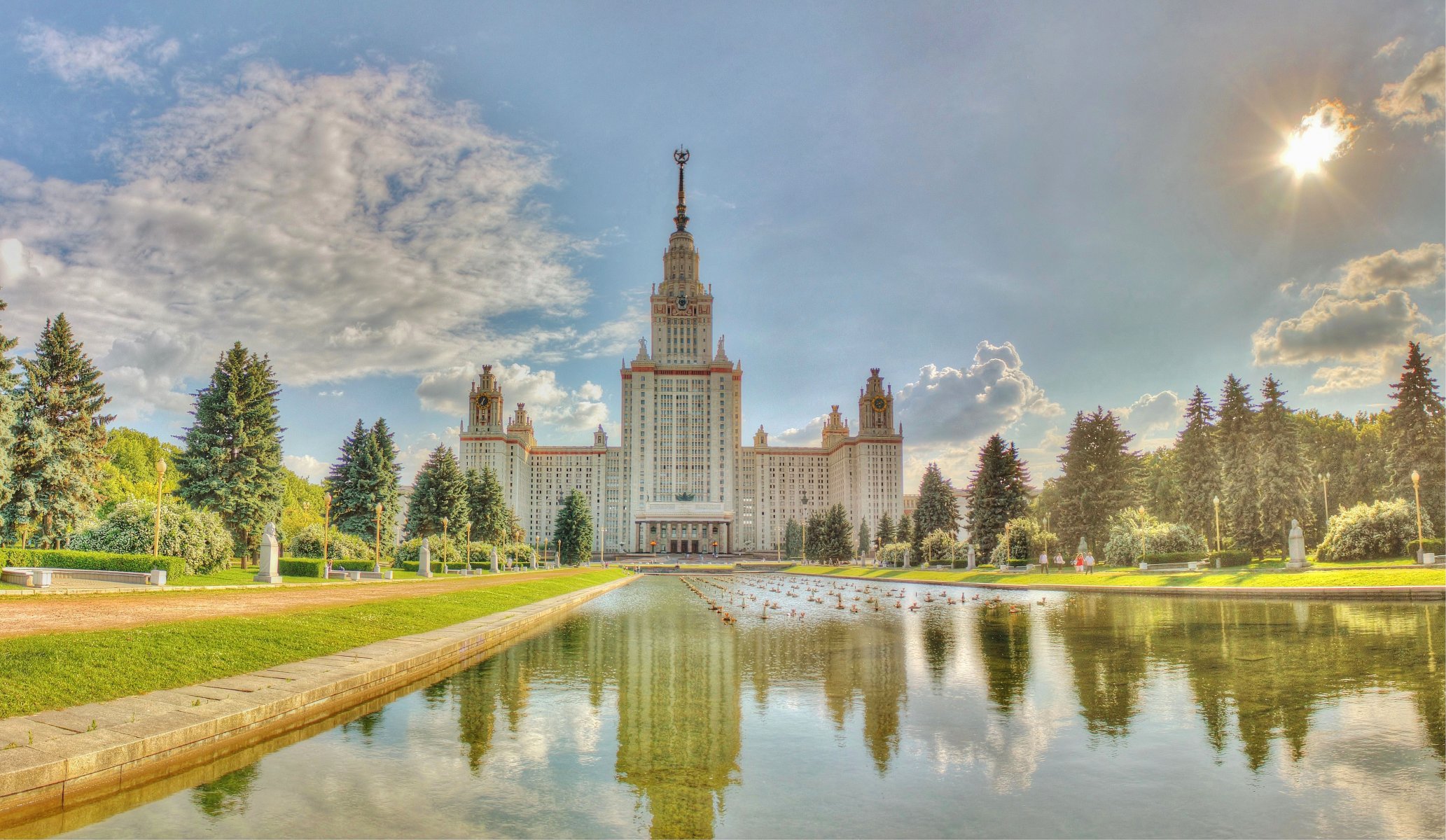 moscow university summer sky clouds water pond grass tree people