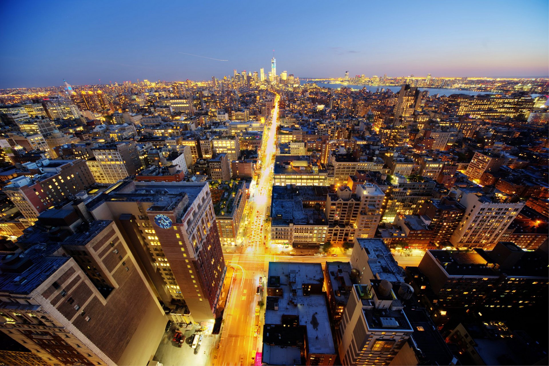 new york manhattan midtown chelsea stratus usa evening city skyscrapers buildings high-rise roofs roads lights lights panorama