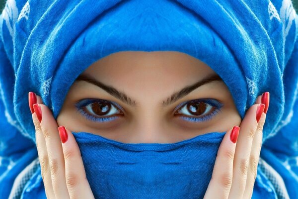 Brown-eyed girl with red nails