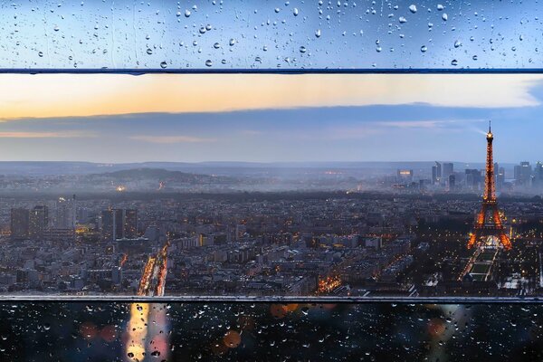 Raindrops on the glass in Paris. Eiffel Tower Lights