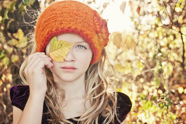 Girl with autumn leaves autumn mood