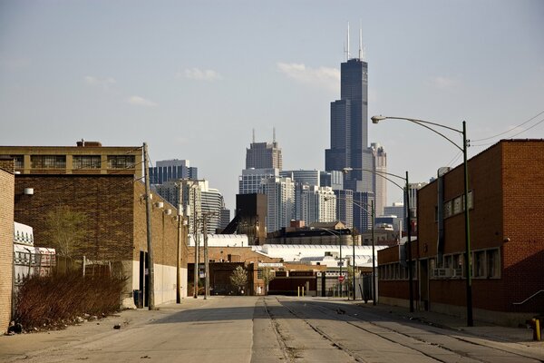 A street in Chicago. The poor area offers a view of majestic skyscrapers