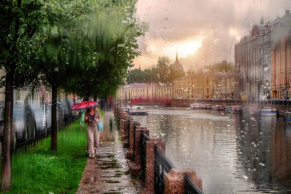 A girl walking in the rain in St. Petersburg