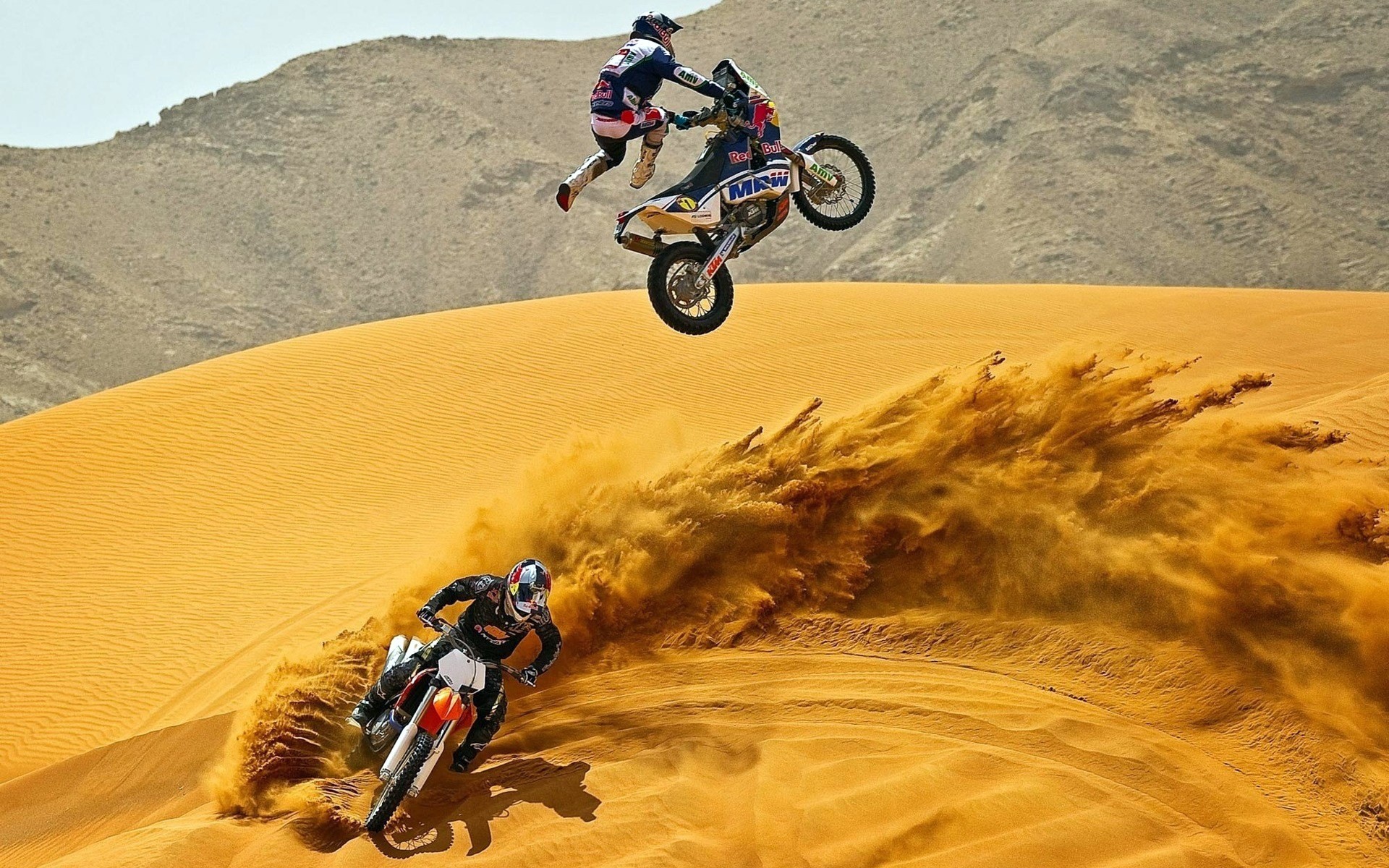 uit helmet motorcycles drawing sand desert