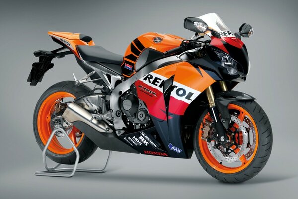 Honda motorcycle orange on gray background