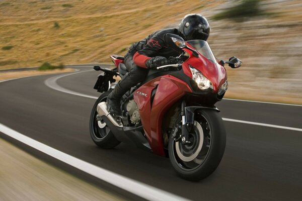 Motorcyclist on a red bike