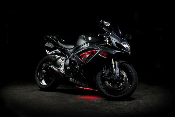 The bike is a real beast, a black Suzuki in the dark