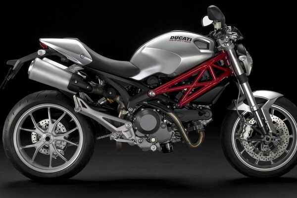 Silver ducati motorcycle with red inserts