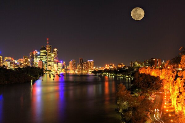 Night city under the light of the full moon