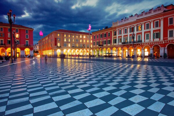 French buildings on the square at night